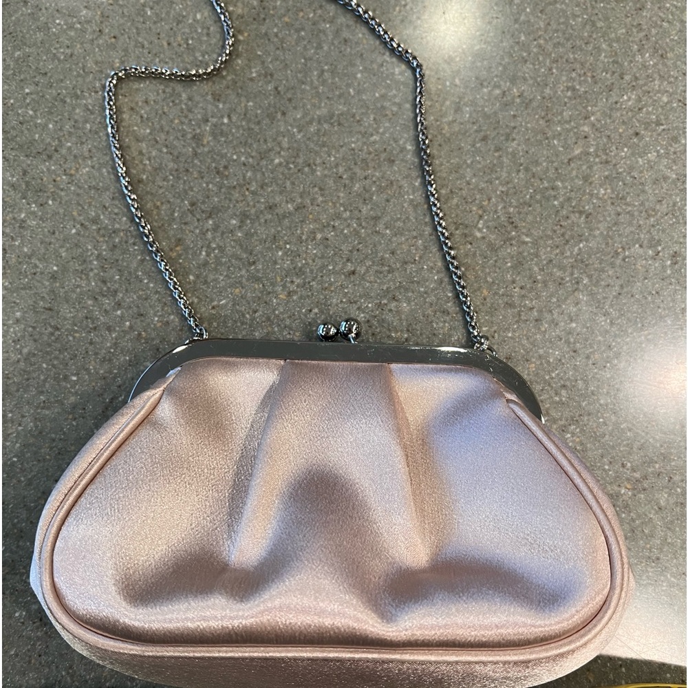 Nina  blush color silk satchel with snake cable.